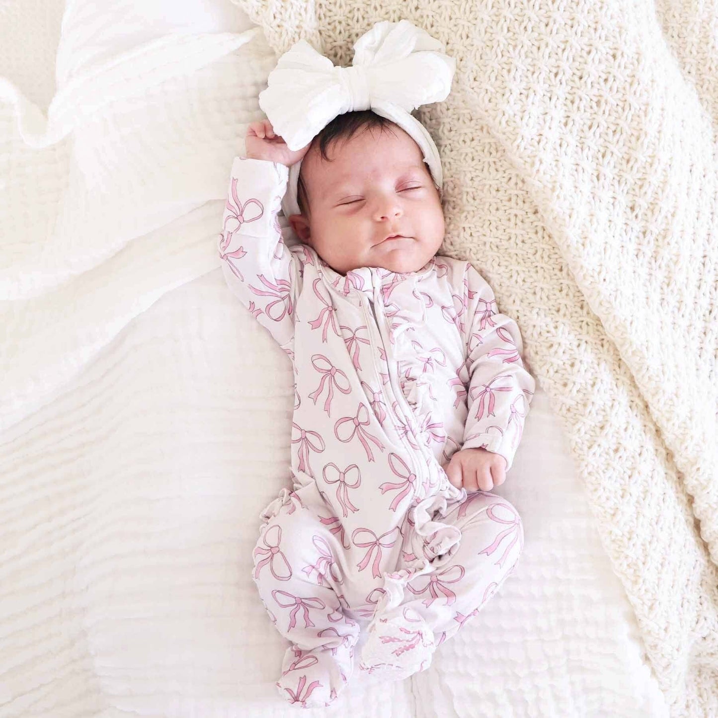 Blushing Bows Ruffle Zipper Footie